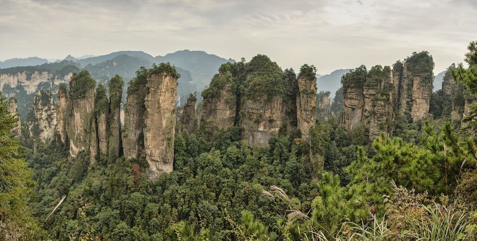 Zhangjiajie, The sandstone pillars behind Avatar, a glass walkway, and a mountain with a door